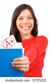 A Plus Top Grade Female Student Proud Of Her Result / Score In A Test. Shallow Depth Of Field, Focus On The Grade. Isolated On White Background,