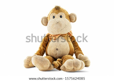 Plush brown monkey doll toy isolated on white background with clipping path