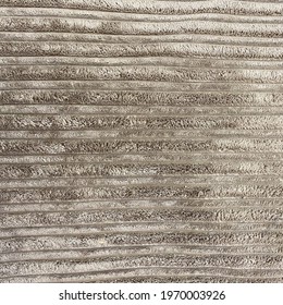 Plush striped velvet upholstery fabric texture in mink brown