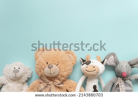 plush toys on the turquoise background