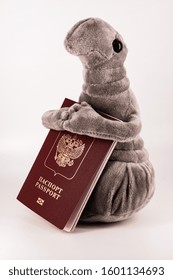 
plush Zhdun with a Russian passport in his hands