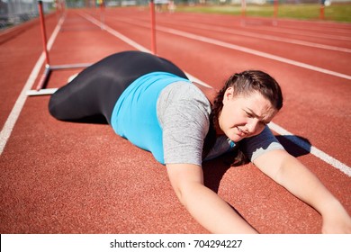 Plus-sized Female Fallen Down Racetrack During Hurdle Marathon