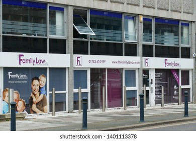 Plymouth Devon England May 2019. Shop Front Showing Family Law Firm Premises Within.  Large Glass Frontage With Purple Writing Above Entrance.