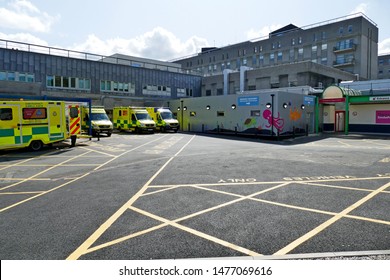 Plymouth England. Ambulances Parked In Reception Area Of University Hospitals Plymouth NHS Trust. Also Known As Derriford Hospital. Views Of The Hospital And Hospital Grounds.