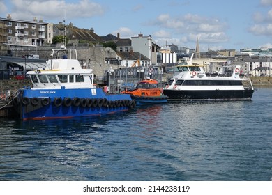 Plymouth England April 2020. The Barbican With Pilot Boat, Working Boat And Pleasure Craft Moored Alongside A Pontoon.