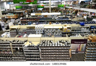 Plymouth England August. D-I-Y  Retail Store Looking Out Over Shelves Of Pots Of Interior Paint Stacked On Shelves In Rows. Long View Across Store. No People. Shelves Fully Stacked.