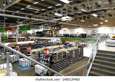 Plymouth England .D-I-Y  Retail Store Looking Out Over Shelves Of Pots Of Interior Paint Stacked On Shelves In Rows. Long View Across Store. No People. Shelves Fully Stacked.