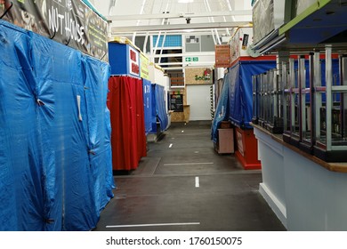 Plymouth England June 2020. Interior Of  Pannier Market During Covid-19 Lock Down. Closed Stalls Covered In  Plastic Sheeting.Two Meter Distance Lines On Floor. Chairs Stacked Cafe Counter. No People