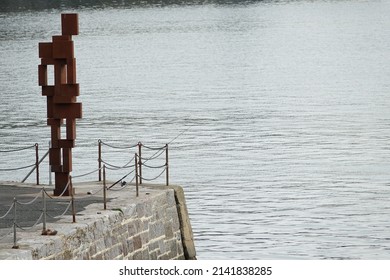 Plymouth England March 2022. Look II statue on Plymouth waterfront by Sir Anthony Gormley. Mayflower 400 monument. Installation and statue cost £764.038. Known locally as Rusty Reg.