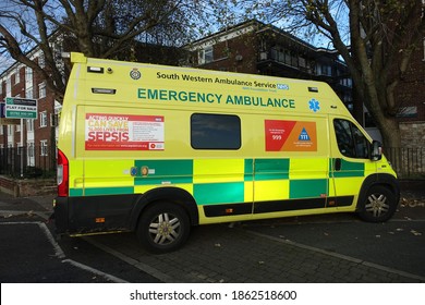 Plymouth England November 2020. Side On View Of A Yellow And Green National Health Service Emergency Ambulance. Signage On Side Giving Advice On Sepsis And Contact Details.