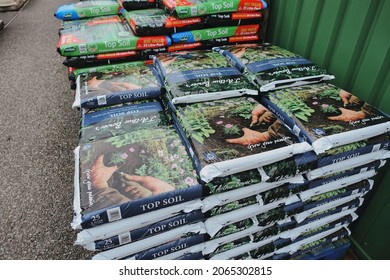  Plymouth England November 2021. Stacked Large Plastic Bags On Pallets Of Compost, Topsoil And Potting Compost                              