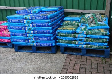  Plymouth England November 2021. Stacked Large Plastic Bags On Pallets Of Compost, Topsoil And Potting Compost                              