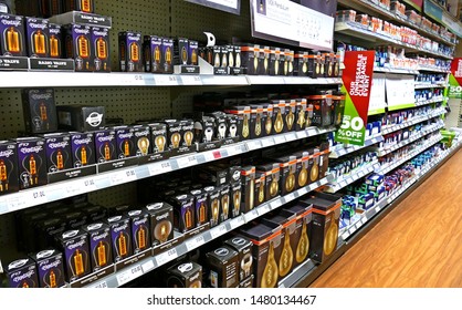 Plymouth England. Retail Store. Shelves Of Electrical Goods And Hardware, Five Shelves High And Full With Products. No People. Wide Walkway.  Small Items. 