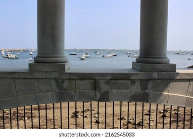 Plymouth, MA, USA, 9.14.21 - Looking out through the majestic columns of the Plymouth Rock memorial into the harbor.