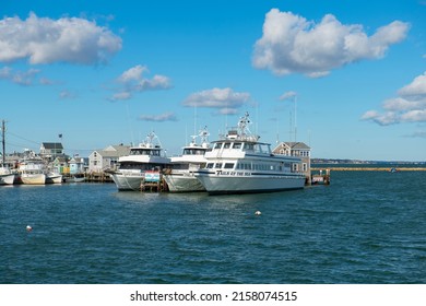 PLYMOUTH, MA, USA - NOV. 5, 2021: Whale watch ship Capt. John and Son and Tails of the Sea docked at Town Wharf at historic town center of Plymouth, Massachusetts MA, USA. 