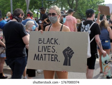 Plymouth, Michigan, USA - June 3, 2020: Women Holding Black Lives Matter Protest Sign.