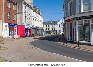 Plymouth, UK. 13/4/20:  A Deserted British High Street With Closed Shops On A Bright Sunny Day.