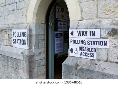 Plymouth UK. 2/5/19: The entrance to a British polling station with various signs around the doorway.