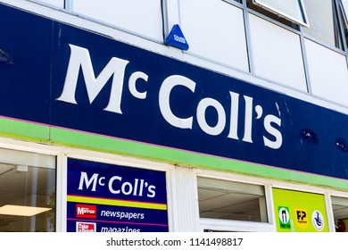 Plymouth, UK. 7/24/18:  The Front Of A McColl's Newsagent On A British High Street.