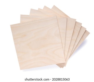Plywood boards isolated on white background. Stack of plywood pieces on white