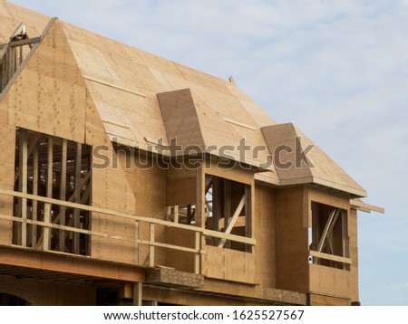 plywood roof and wall sheathing on a residential construction project