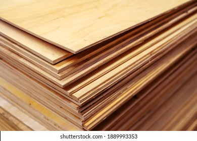 A lot of plywood sheets are stacked. Trade in wood building materials. Close-up