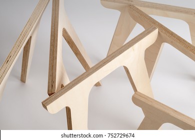 Plywood Table Legs On A Gray Background