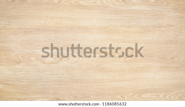 Plywood or wood texture background,\
top view of light wooden table. Tree wood surface with nature color\
and pattern. Ash or oak plywood for abstract backdrop.\
