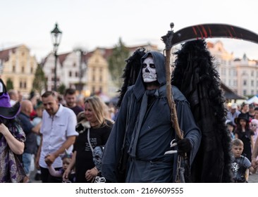 PLZEN, CZECH REPUBLIC - 11. 6. 2022: Historical weekend in Pilsen (Plzeň). Monster parade. Evening procession of the monsters and ghosts through the historical town. Grim Reaper with a scythe