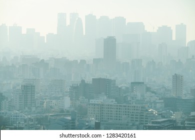 PM2.5 Unhealthy air pollution dust smoke in the urban city. Low visibility city view with dangerous haze and fog. - Powered by Shutterstock