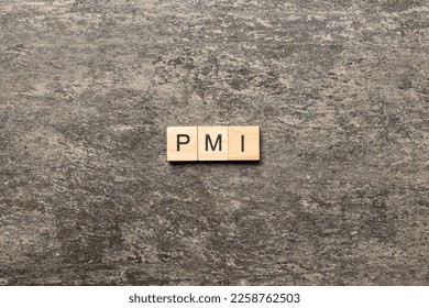 PMI word written on wood block. Project Management Institute text on table, concept. - Shutterstock ID 2258762503