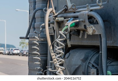 Pneumatic And Hydraulic Hoses And Connections Of Back Of Tractor Trailer Cab.