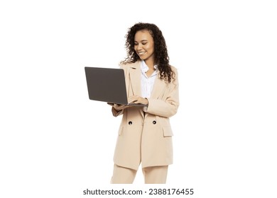 PNG, Attractive businesswoman in a suit with a laptop, isolated on white background