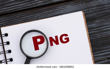 PNG (Portable Network Graphics) - word written in a notebook on a dark beautiful background with a magnifying glass. Internet concept