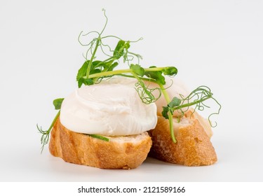 Poached egg on bread isolated on white background. Sandwich with  boiled egg isolated on white. Poached egg on toast. 