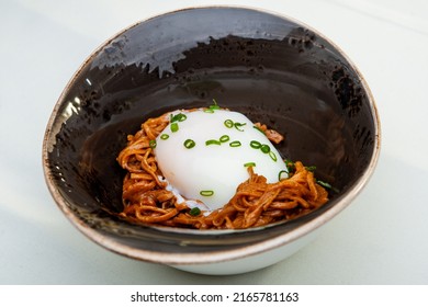 Poached Egg Over Noodles With Amber Ale