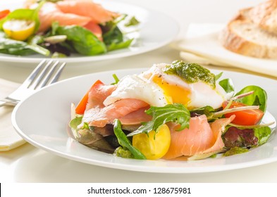 Poached Egg Salad With Smoked Salmon, Cherry Tomatoes And Pesto.