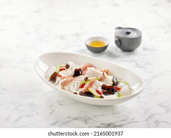 Poached Garoupa Fillet In Ginger Wine Fish Broth Served In A Dish Side View On Grey Background