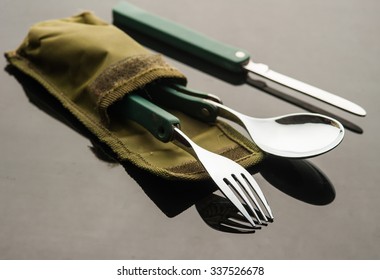 pocket army fork and spoon with reflection.