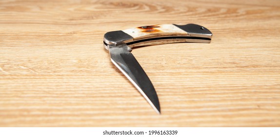 Pocket Knife On The Table