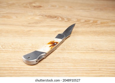 Pocket Knife On The Table