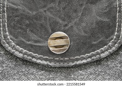 Pocket Metallic Snap Button On Black Leather And Fabric Closeup