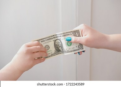 Pocket Money Concept. Woman's Hand Giving Dollar Note To A Child. Money For Kids, Children And Finance. Donation And Charity. Payment And Transfer Currency.