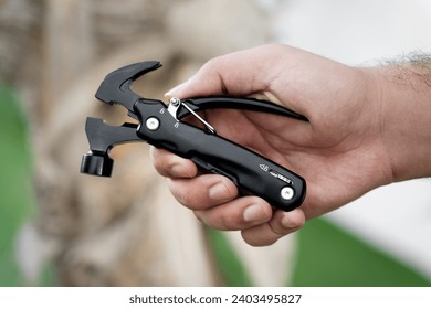 Pocket Multi tool in a hand outdoor
