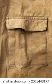 Pocket of an old military jacket in khaki canvas - Shutterstock ID 2035448177