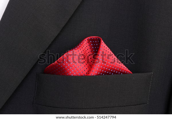 pocket square - handkerchief in the breast pocket\
of a man\'s blue wool\
suit\
