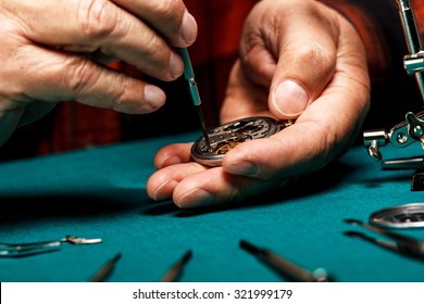 Pocket Watch Being Repaired By Senior Watch Maker, Close-up.