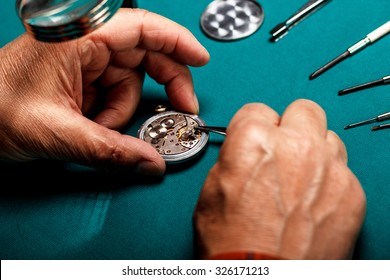 Pocket Watch Being Repaired By Senior Watch Maker, Close-up.