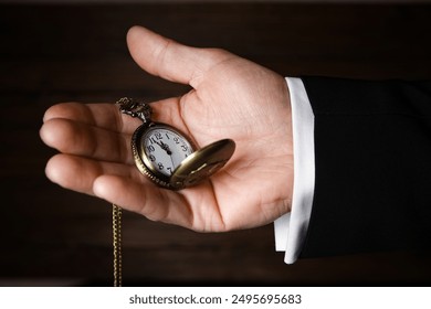 pocket watch in the hands of a man - Powered by Shutterstock