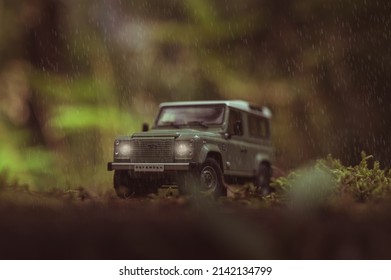 PODBREZOVA, SLOVAKIA - JULY 24 2021: Land Rover Defender On Offroad Trip. Scale Model Land Rover In Summer Forest. Off Road Car In Forest Jungle.